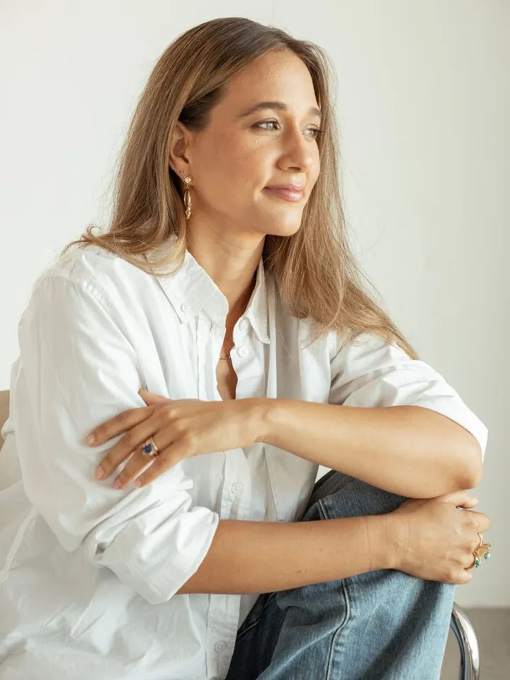 A patient smiling, relaxed at home