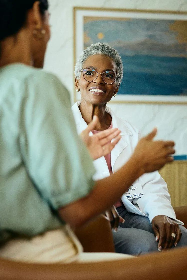 A clinician talking with a patient